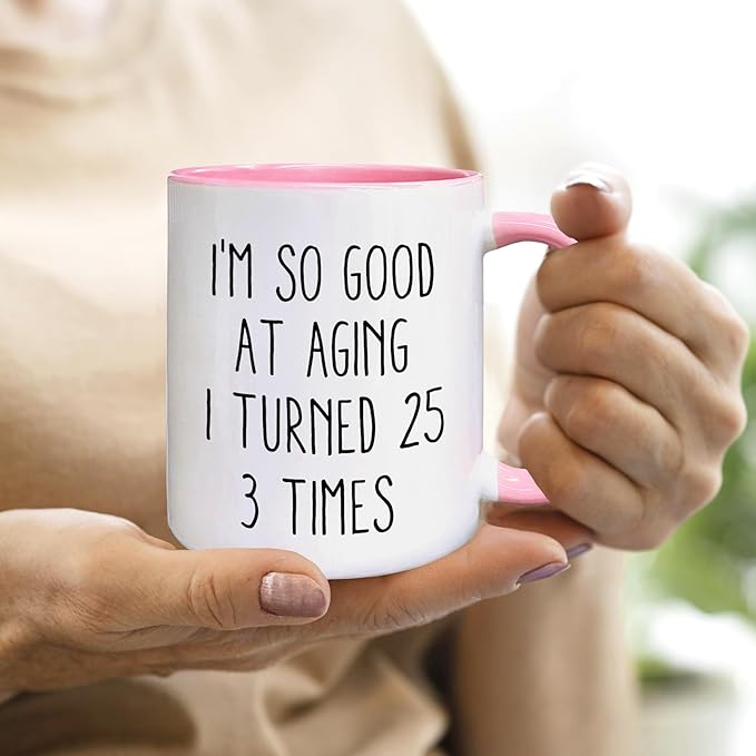 QASHWEY 75 Birthday Gifts for Women Men Coffee Mug, FunnyBirthday Coffee Mugs, I'm So Good At Aging I Turned 25 3 Times CoffeeCups, 75th Birthday Gifts for Women Tea Cup Mug Cup (Pink)